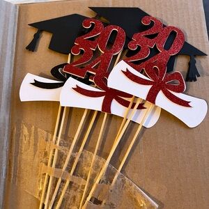 Graduation picks for decorations. 16 pieces total. Red and black. Some glitter.